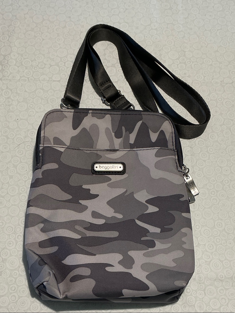 Baggallini Take Two RFID Bryant Crossbody Bag in the "Grey Camo Print" pattern.